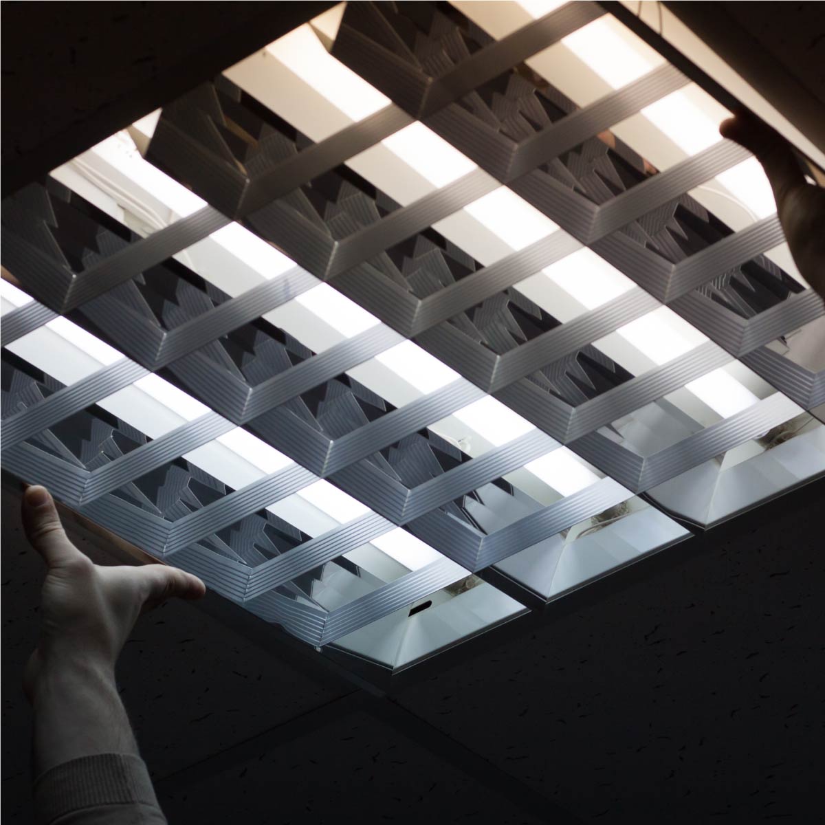 Shine Retrofits Technician Replacing Ceiling Light Cover