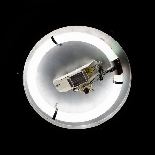 32-Watt fluorescent ballast lamp with light on in front of black background