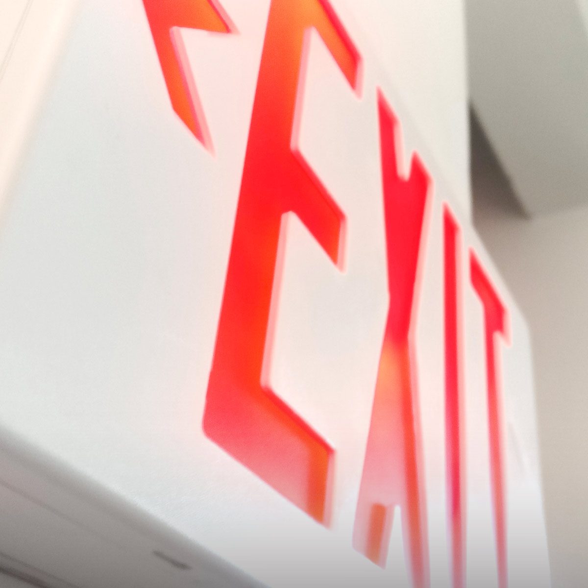 Shine Retrofits Red Exit Sign Closeup